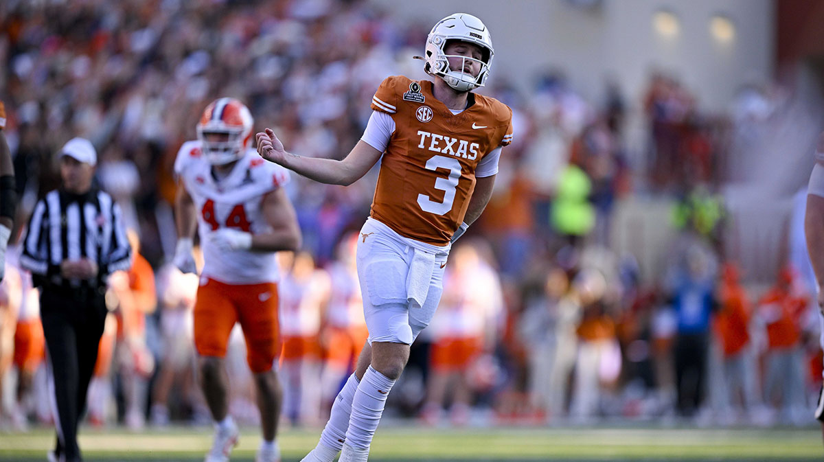 Texas Longhorns quarterback Quinn Ewers (3) celebrates after he throws a touchdown pass against the Clemson Tigers during the second quarter of the CFP National Playoff first round game at Darrell K Royal-Texas Memorial Stadium.
