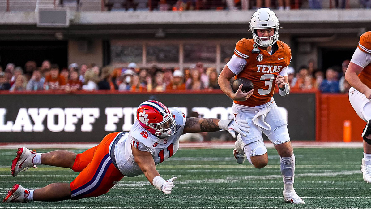Texas Longhorns quarterback Quinn Ewers (3) runs the ball during the game against Clemson in the first round of the College Football Playoffs at Darrell K Royal-Texas Memorial Stadium.