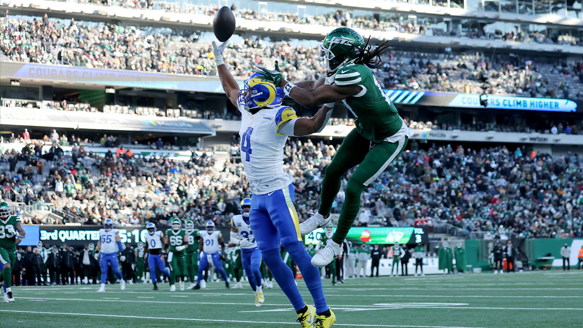 Los Angeles Rams cornerback Ahkello Witherspoon (4) breaks up a pass intended for New York Jets wide receiver Davante Adams (17) during the third quarter at MetLife Stadium.
