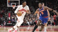 Toronto Raptors guard RJ Barrett (9) drives against New York Knicks forward OG Anunoby (8) during the second half at Scotiabank Arena.