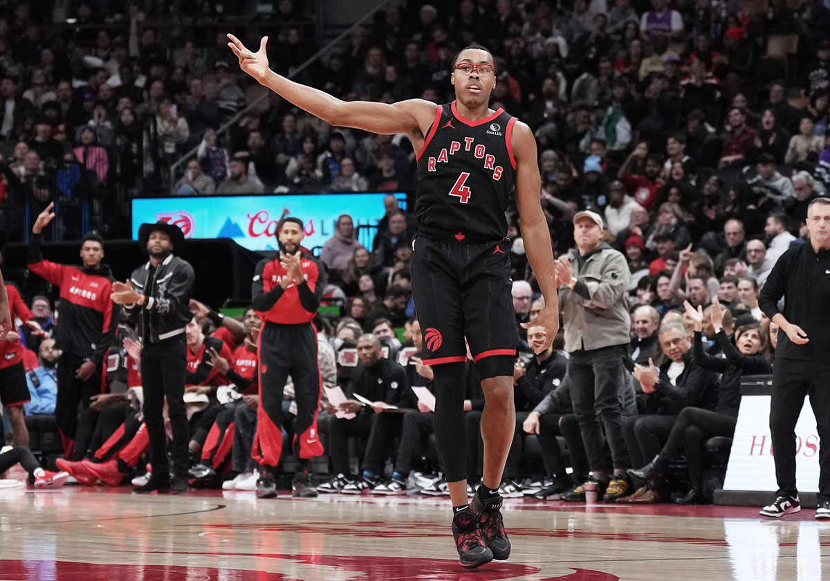 Toronto Raptors forward Scottie Barnes (4) reacts after scoring a three point basket against the Dallas Mavericks during the fourth quarter at Scotiabank Arena.