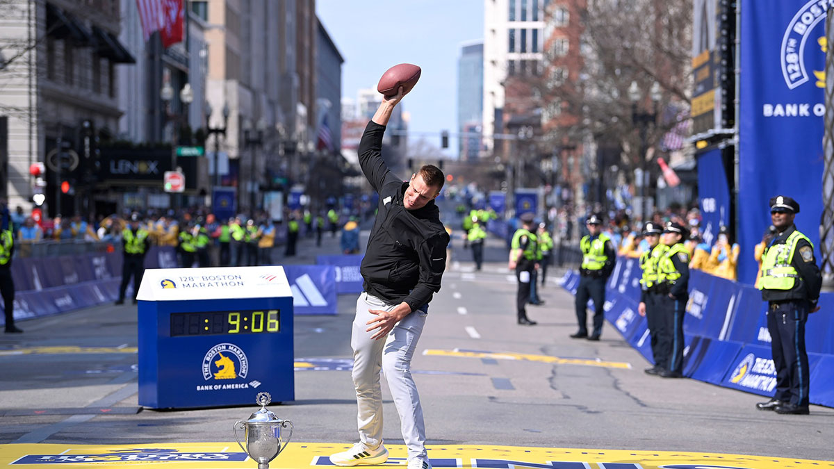 Apr 15, 2024; Boston, MA, USA; Former New England Patriots tight end and honorary Grand Marshall Rob Gronkowski spikes a football on the finish line of the 2024 Boston Marathon.