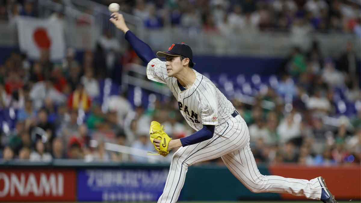 Japan starting pitcher Roki Sasaki (14) delivers a pitch during the first inning against Mexico at LoanDepot Park. 