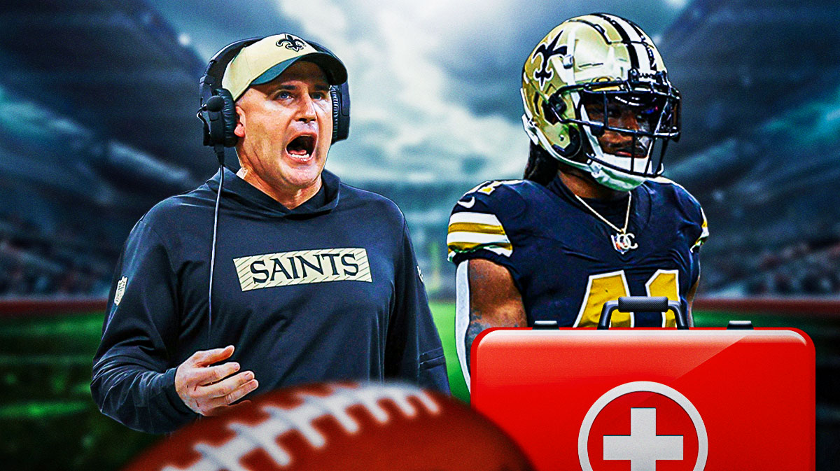 Darren Rizzi. Alvin Kamara with a first aid kit near him