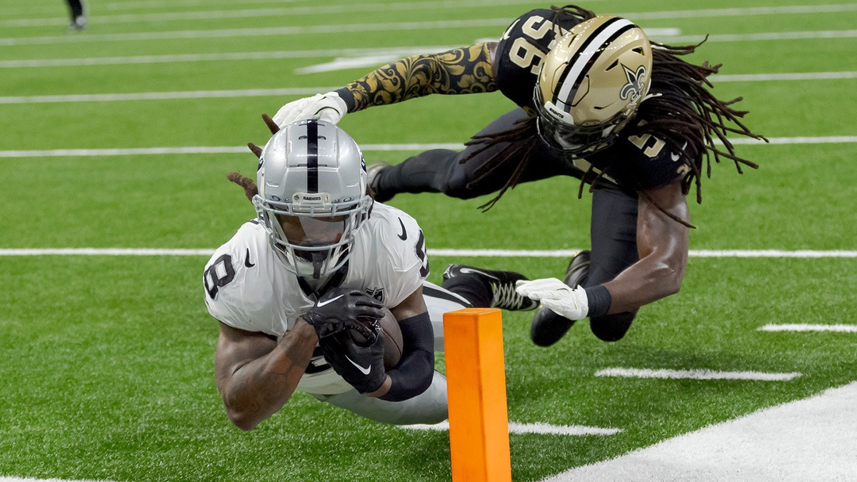 Las Vegas Raiders running back Ameer Abdullah (8) is tackled just short of a touchdown by New Orleans Saints linebacker Demario Davis (56) during the first half at Caesars Superdome.