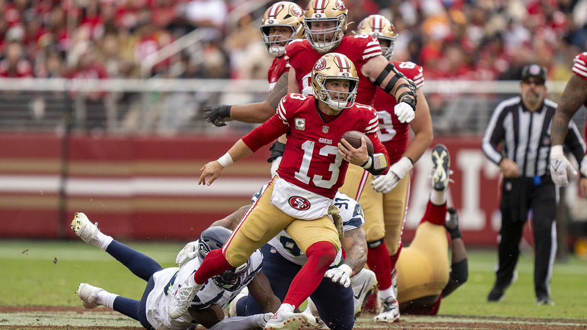 San Francisco 49ers quarterback Brock Purdy (13) runs the football against the Seattle Seahawks during the third quarter at Levi's Stadium.