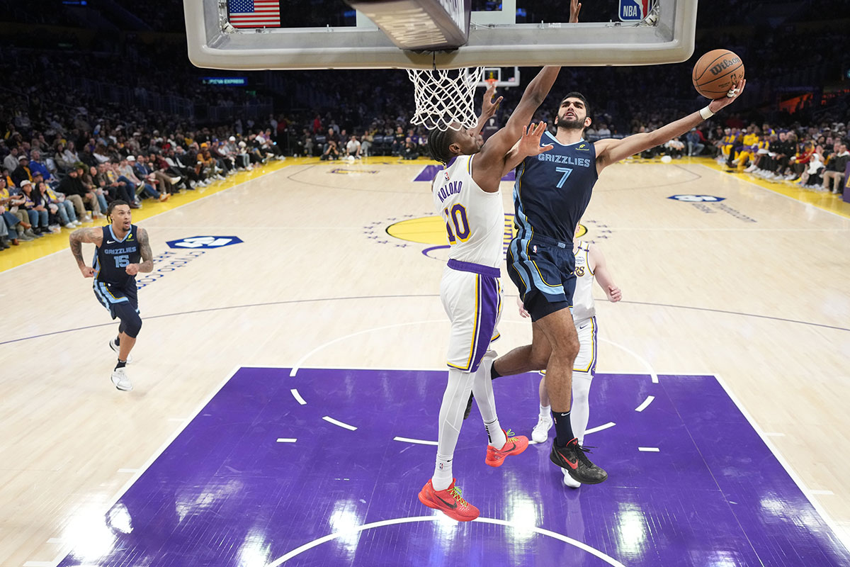 Memphis Grizzlies forward Santi Aldama (7) shoots the ball against Los Angeles Lakers center Christian Koloko (10) in the second half at Crypto.com Arena.