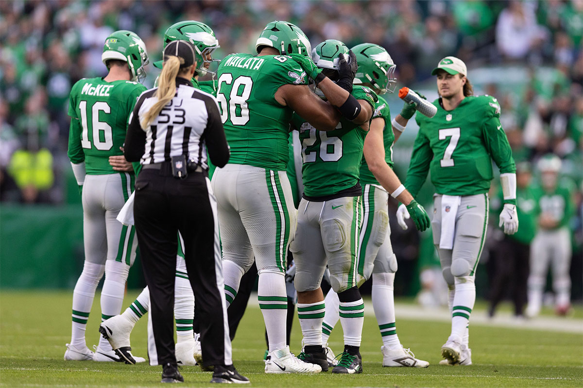 Philadelphia Eagles running back Saquon Barkley (26) celebrates with offensive tackle Jordan Mailata (68) after rushing for 167 yards in a game against the Dallas Cowboys at Lincoln Financial Field.
