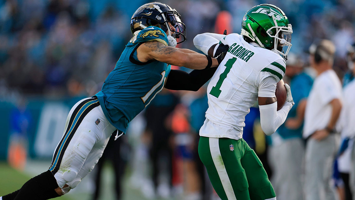 New York Jets cornerback Sauce Gardner (1) hauls in an interception against Jacksonville Jaguars wide receiver Parker Washington (11) during the fourth quarter Sunday, Dec. 15, 2024 at EverBank Stadium in Jacksonville, Fla. The Jets held off the Jaguars 32-25.