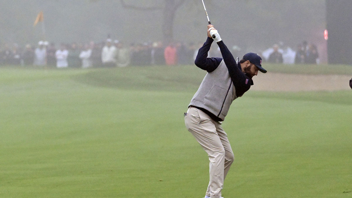 Scottie Scheffler of team U.S.A. hits his approach shot to the first hole during the third round of The Presidents Cup golf tournament