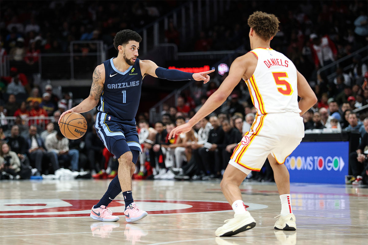 Memphis Grizzlies guard Scotty Pippen Jr. (1) calls a play against Atlanta Hawks guard Dyson Daniels (5) during the second half at State Farm Arena.