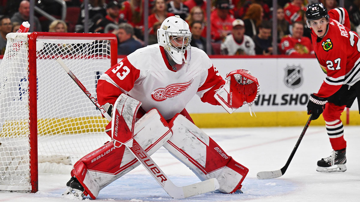 Detroit Red Wings goaltender Sebastian Cossa (33) defends the net against the Chicago Blackhawks at United Center.