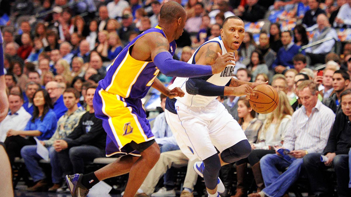 Los Angeles Lakers shooting guard Kobe Bryant (24) guards Dallas Mavericks small forward Shawn Marion (0) during the first quarter at the American Airlines Center.