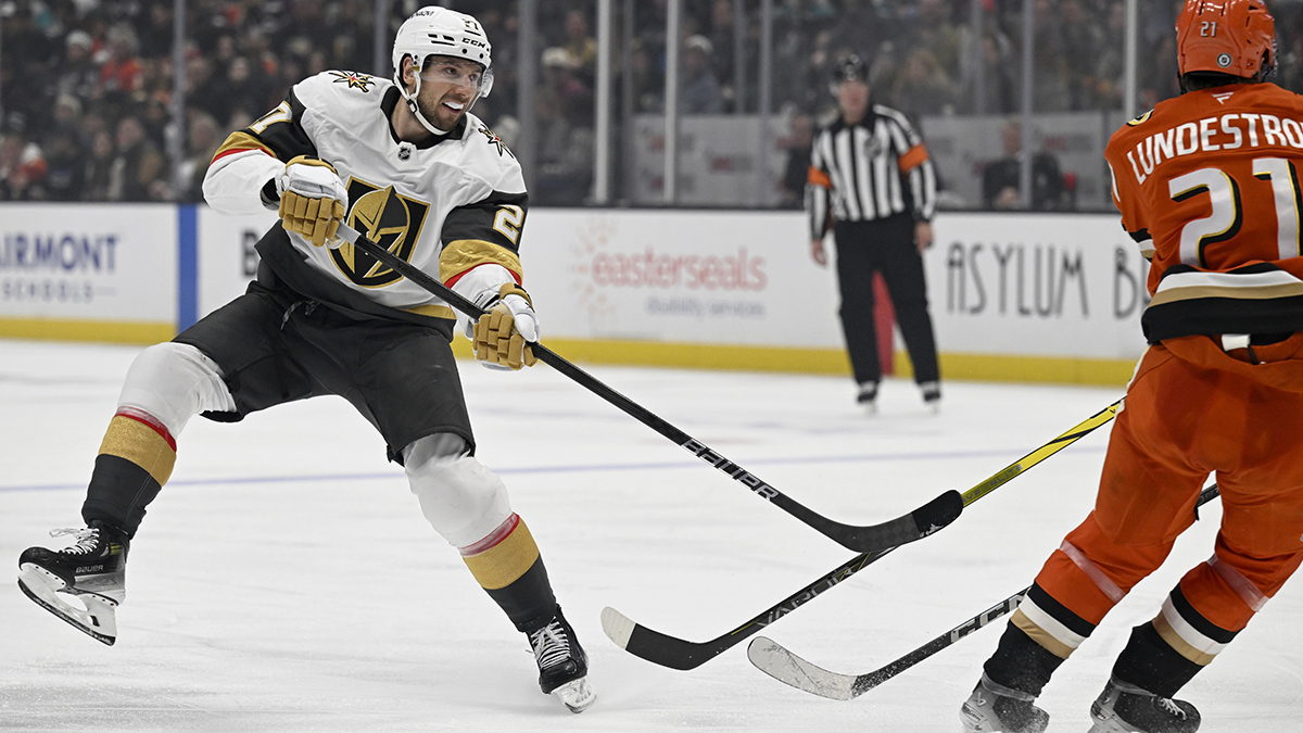 Vegas Golden Knights defenseman Shea Theodore (27) shoots the puck against Anaheim Ducks left wing Cutter Gauthier (61) during the third period at Honda Center.