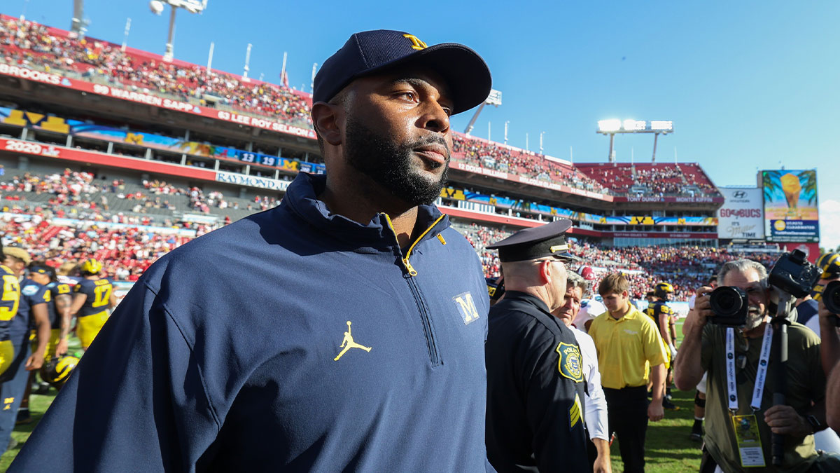 Michigan Wolverines head coach Sherrone Moore celebrates after beating the Alabama Crimson Tide in the ReliaQuest Bowl at Raymond James Stadium.