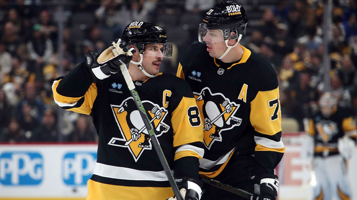 Pittsburgh Penguins center Sidney Crosby (87) and center Evgeni Malkin (71) talk before a face-off against the Vancouver Canucks during the third period at PPG Paints Arena.