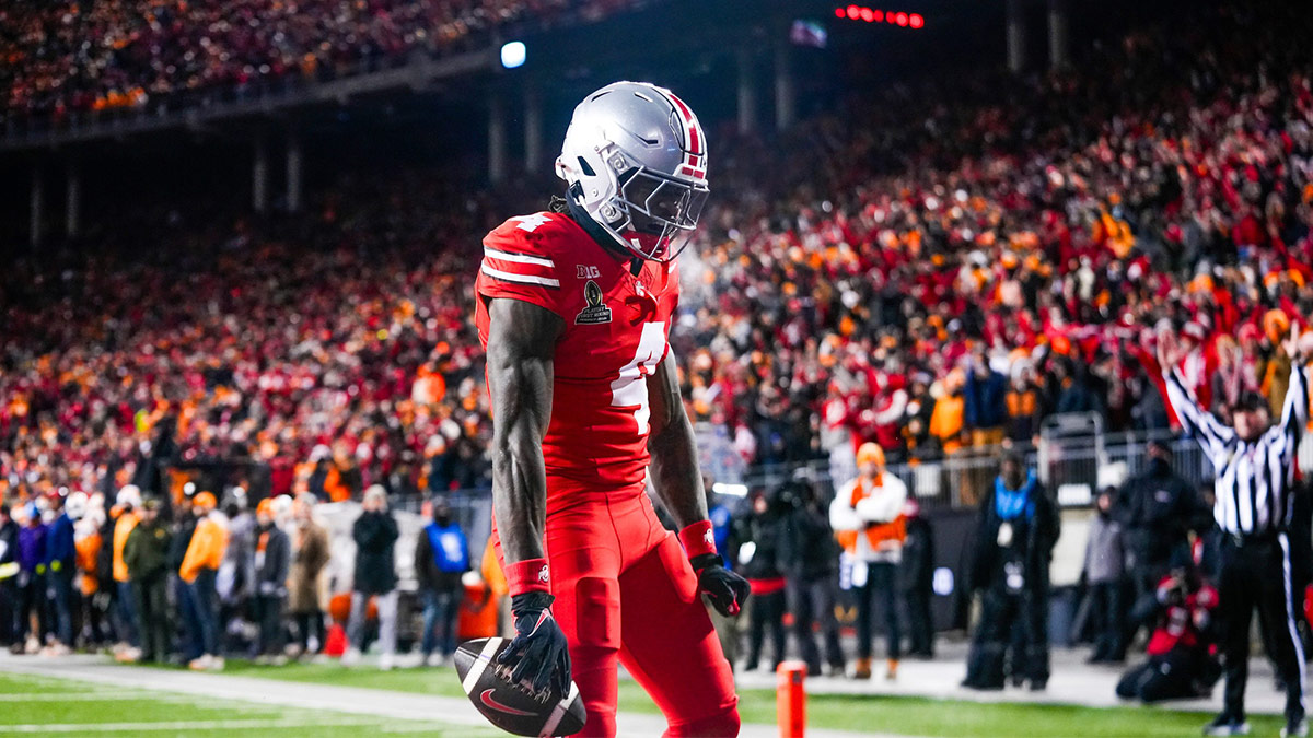 Ohio State Buckeyes wide receiver Jeremiah Smith (4) reacts after scoring a touchdown in the first half at Ohio Stadium on Saturday, Dec. 21, 2024 in Columbus, Ohio.