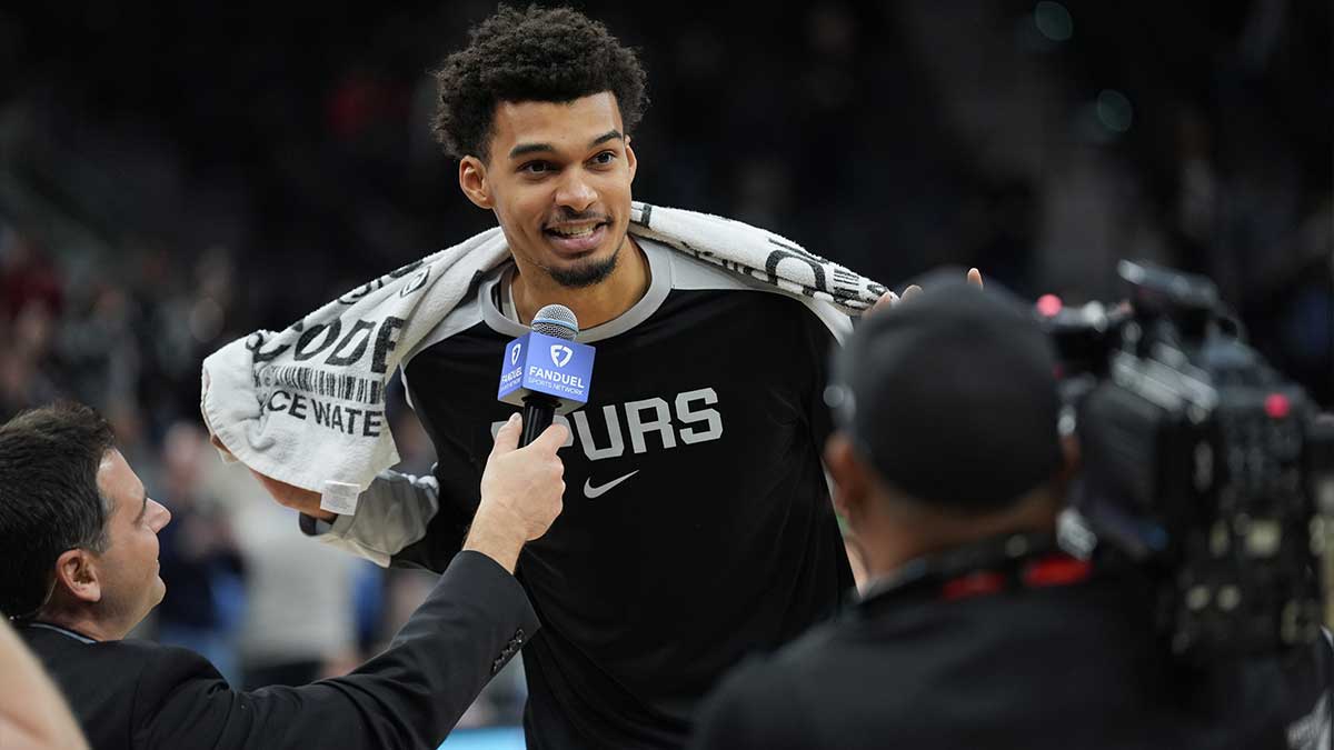San Antonio Spurs center Victor Wembanyama (1) speaks to the crowd after a game against the Portland Trail Blazers at Frost Bank Center.