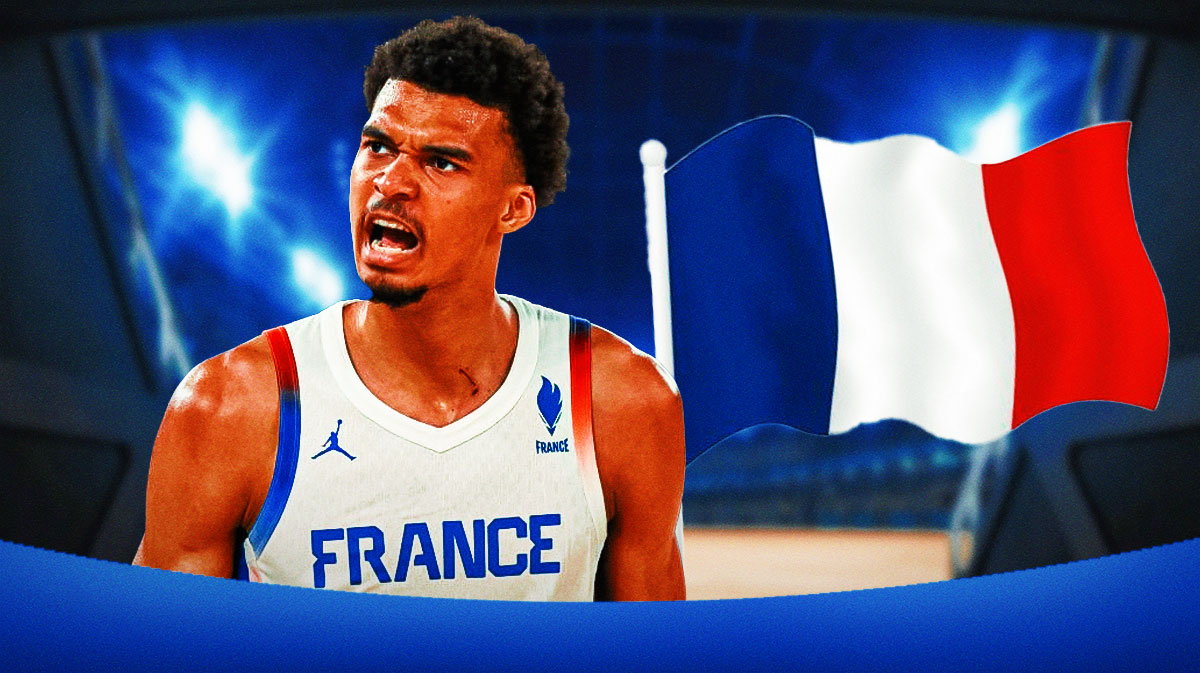 Victor Wembanyama in a France uniform with the french flag next to him