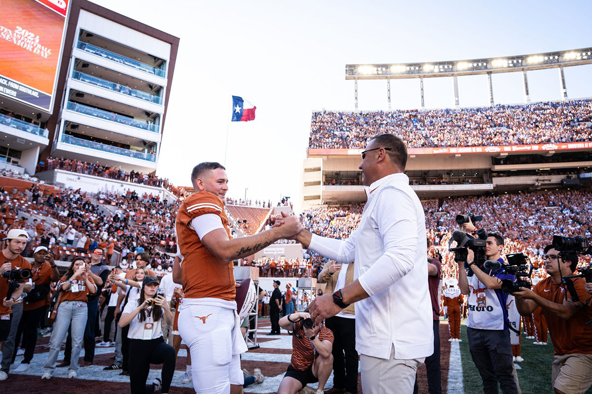 Texas Longhorns head coach Steve Sarkisian embraces quarterback Quinn Ewers (3) as Ewers is honored as one of Texas' seniors in their last home game pf the season against the Kentucky Wildcats