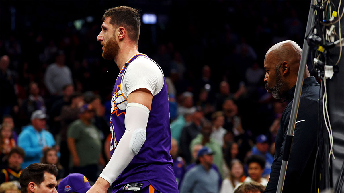 Suns center Jusuf Nurkic (20) walks off the court after being punched by Dallas Mavericks forward Naji Marshall (not pictured) at Footprint Center