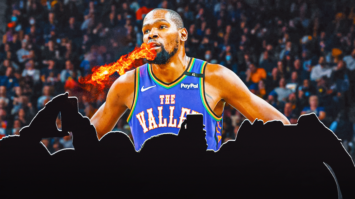 Suns forward Kevin Durant is breathing fire and silhouettes of fans are below him, and a background of the Footprint Center.