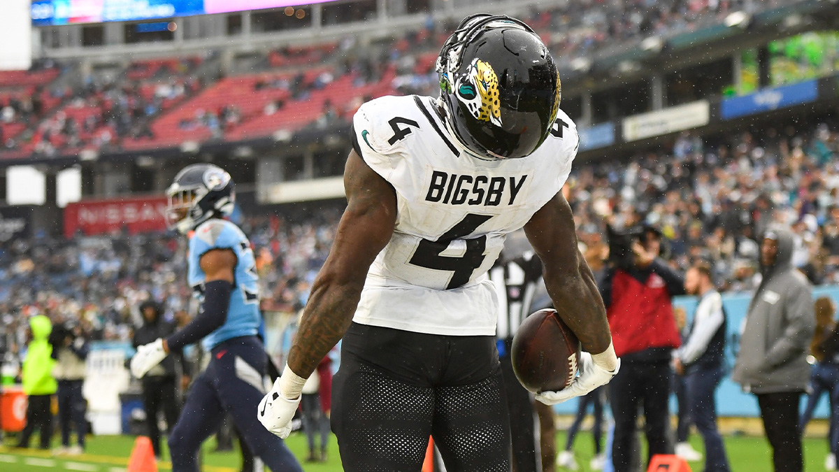 Jacksonville Jaguars running back Tank Bigsby (4) celebrates his touchdown with his teammates against the Tennessee Titans during the second half at Nissan Stadium.