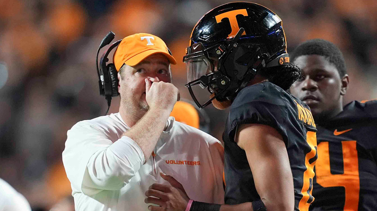 Tennessee head coach Josh Heupel talks to Tennessee quarterback Nico Iamaleava (8) on the sideline during a game between Tennessee and Kentucky at Neyland Stadium in Knoxville, Tenn., Saturday, Nov. 2, 2024.