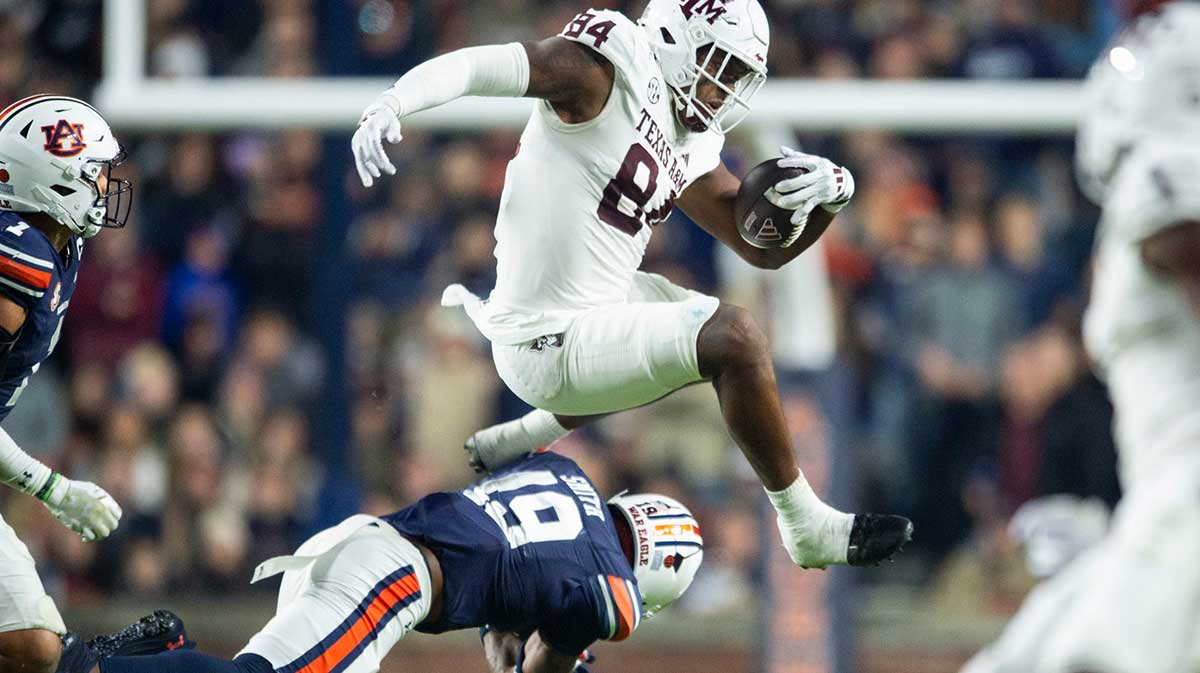 Texas A&M Aggies tight end Tre Watson (84) attempt to hurdle Auburn Tigers safety Sylvester Smith (19) as Auburn Tigers take on Texas A&M Aggies at Jordan-Hare Stadium in Auburn, Ala., on Saturday, Sept. 7, 2024. Auburn Tigers defeated Texas A&M Aggies 43-41 in fourth overtime.