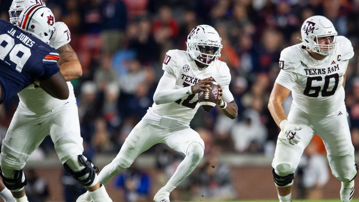 Texas A&M Aggies quarterback Marcel Reed (10) runs the ball as Auburn Tigers take on Texas A&M Aggies at Jordan-Hare Stadium in Auburn, Ala., on Saturday, Nov. 23, 2024. Auburn Tigers lead Texas A&M Aggies 21-7 at halftime.