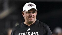 Texas A&M Aggies head coach Mike Elko walks on the field prior to the game against the New Mexico State Aggies at Kyle Field.