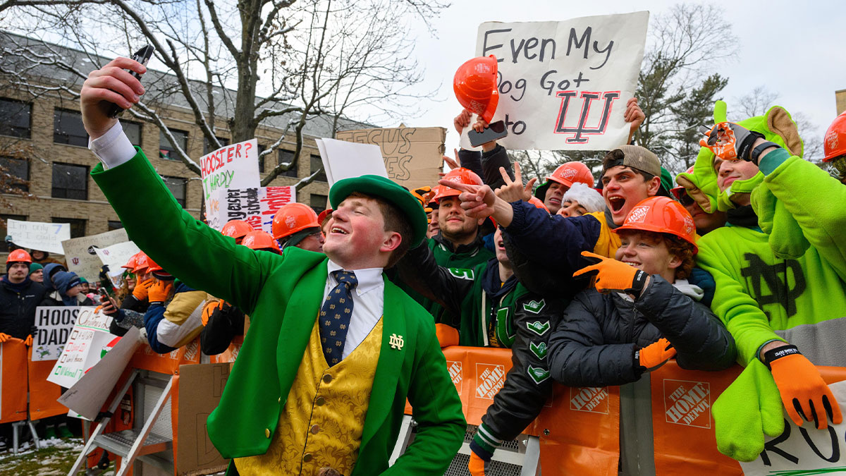 The Notre Dame Leprechaun takes a selfie with fans gathered to watch ESPN College Gameday on the University of Notre Dame campus before the College Football Playoff first round game between the Notre Dame Fighting Irish and the Indiana Hoosiers at Notre Dame Stadium.