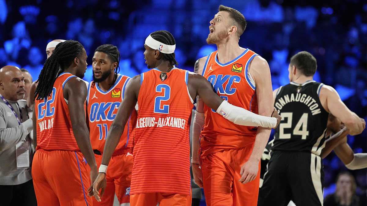 Thunder center Isaiah Hartenstein (55) is held back by guard Shai Gilgeous-Alexander (2) during the 2nd quarter of the Emirates NBA Cup championship game against the Milwaukee Bucks at T-Mobile Arena
