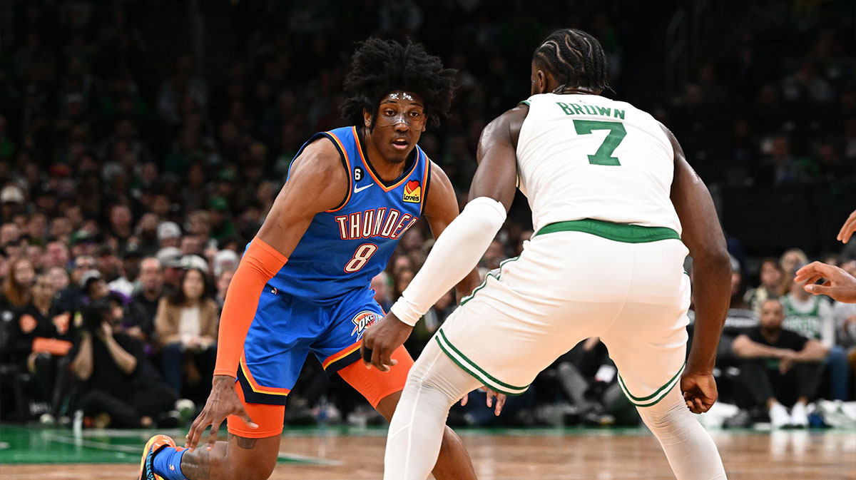 Thunder forward Jalen Williams (8) dribbles the ball against ]Boston Celtics guard Jaylen Brown (7) during the second half at the TD Garden