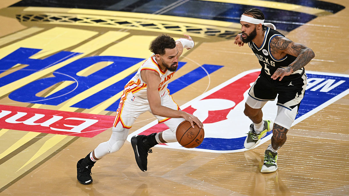 Dec 14, 2024; Las Vegas, Nevada, USA; Atlanta Hawks guard Trae Young (11) controls the ball against Milwaukee Bucks guard Gary Trent Jr. (5) during the fourth quarter in a semifinal of the 2024 Emirates NBA Cup at T-Mobile Arena. Mandatory Credit: Candice Ward-Imagn Images