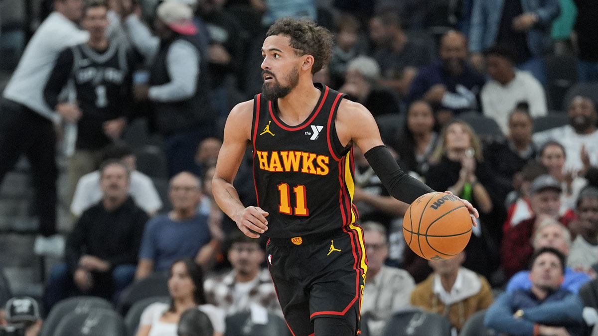 Atlanta Hawks guard Trae Young (11) dribbles the ball in overtime against the San Antonio Spurs at Frost Bank Center.
