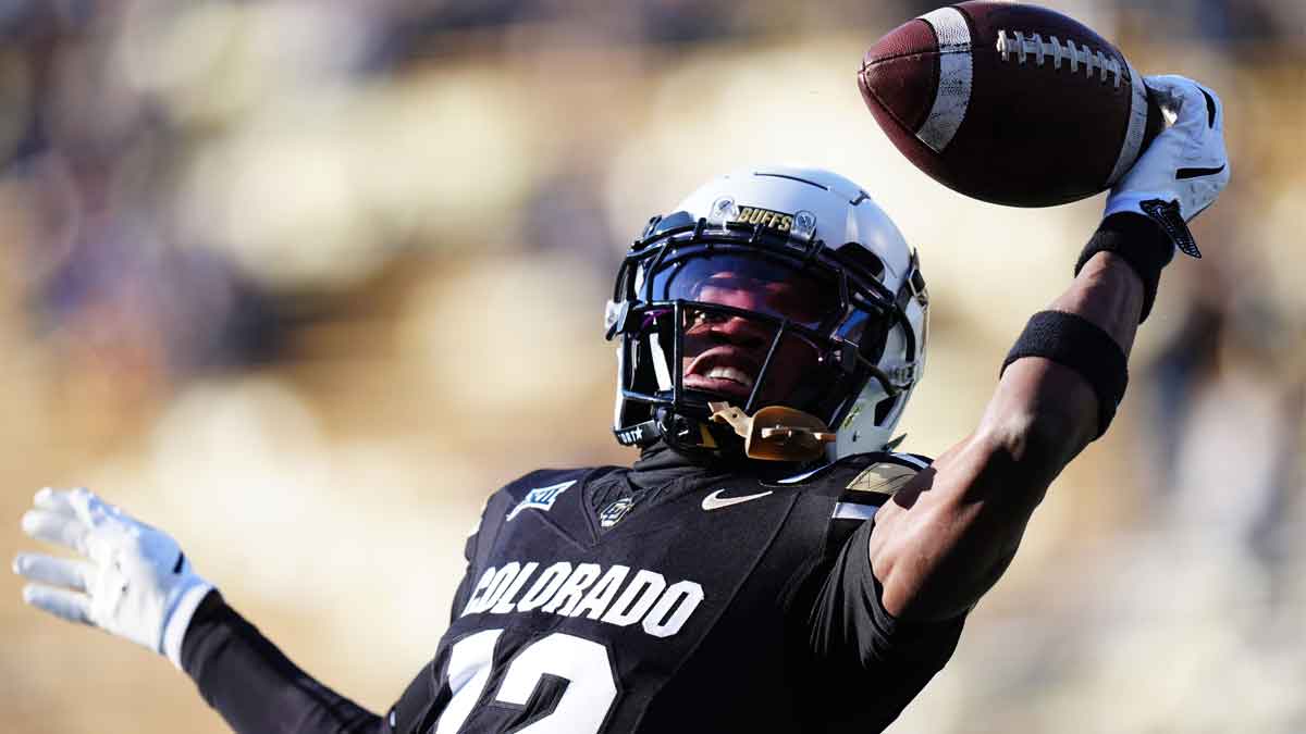 Colorado Buffaloes wide receiver Travis Hunter (12) warms up before the game against the Oklahoma State Cowboys at Folsom Field.