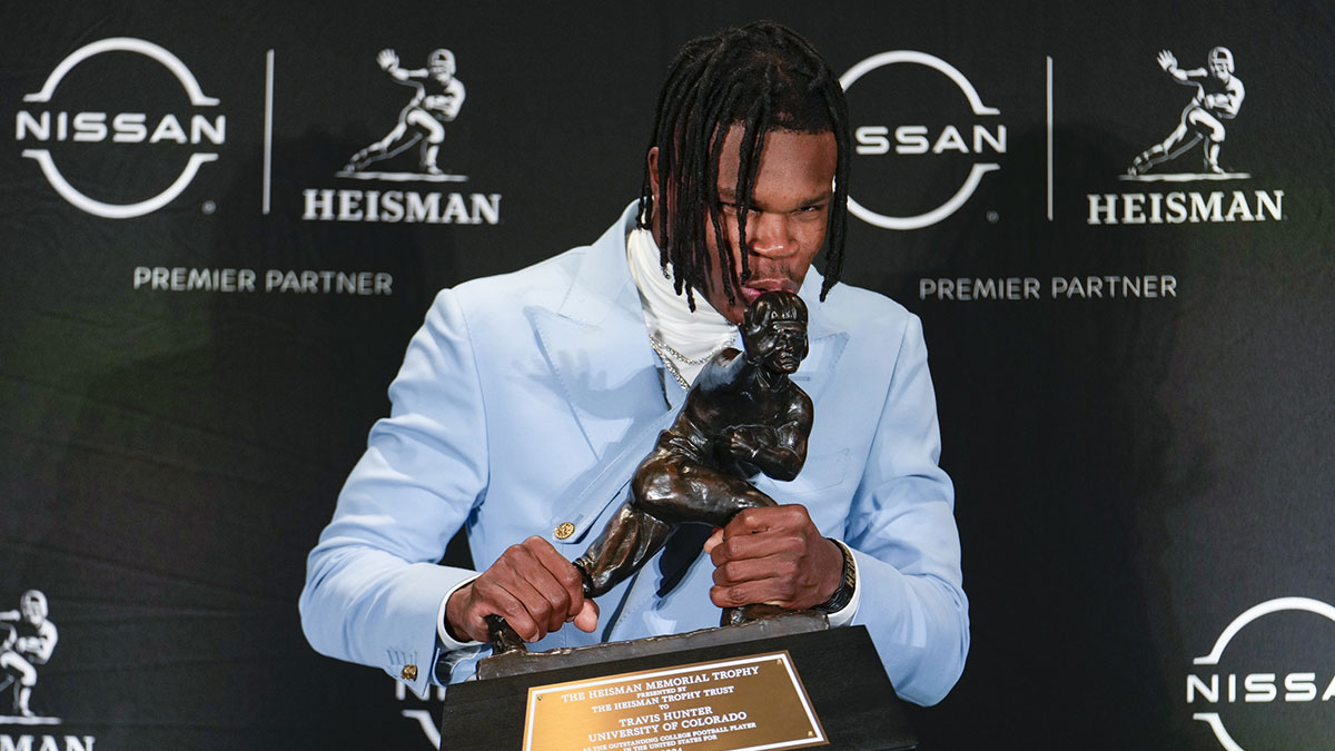 Colorado Buffaloes wide receiver/cornerback Travis Hunter poses for a photo after winning the Heisman Trophy