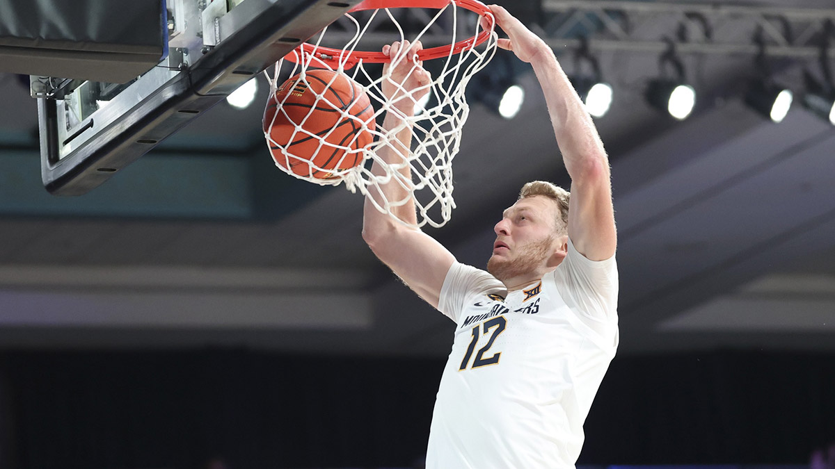 West Virginia Mountaineers guard Tucker DeVries (12) dunks during the first half against the Gonzaga Bulldogs at the Atlantis Resort.