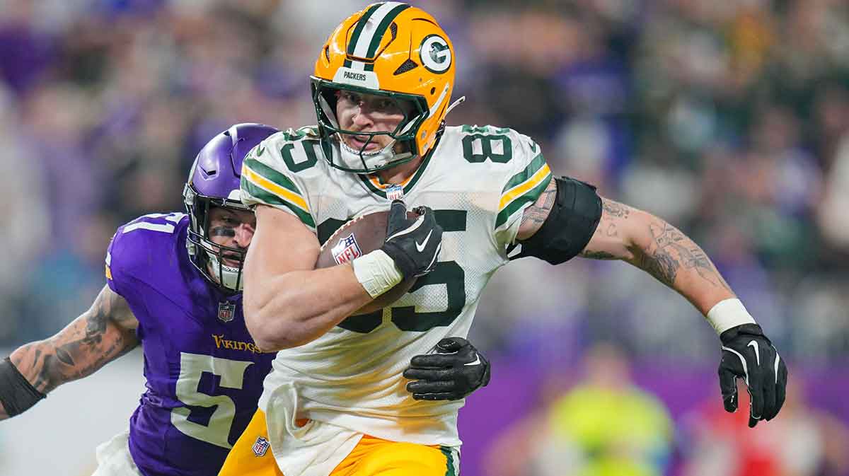 Dec 29, 2024; Minneapolis, Minnesota, USA; Green Bay Packers tight end Tucker Kraft (85) runs after the catch against Minnesota Vikings in the fourthn quarter at U.S. Bank Stadium. 