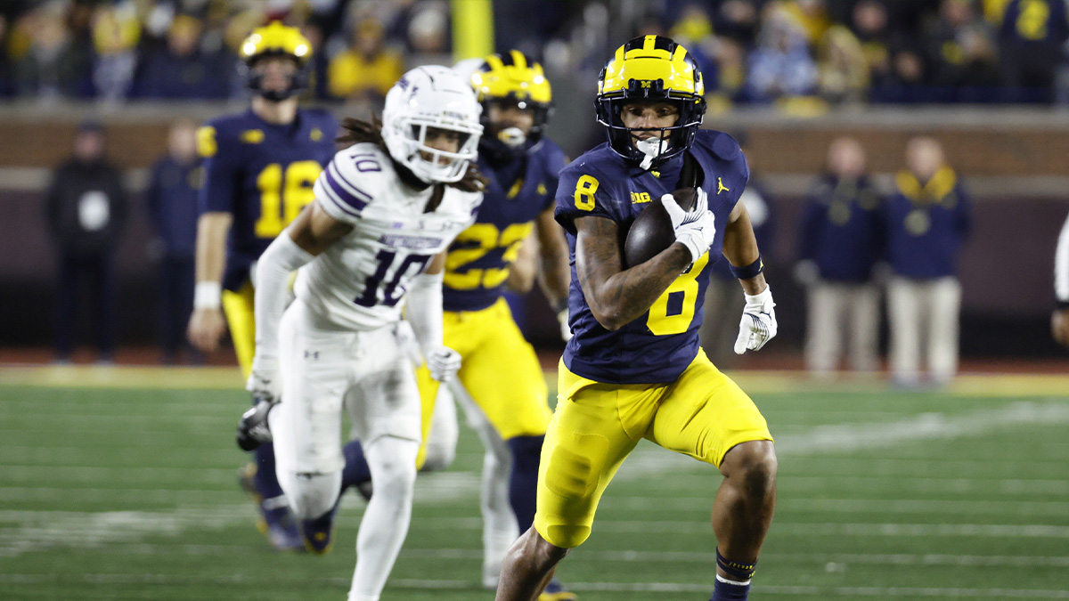 Michigan Wolverines wide receiver Tyler Morris (8) runs the ball against the Northwestern Wildcats in the second half at Michigan Stadium.