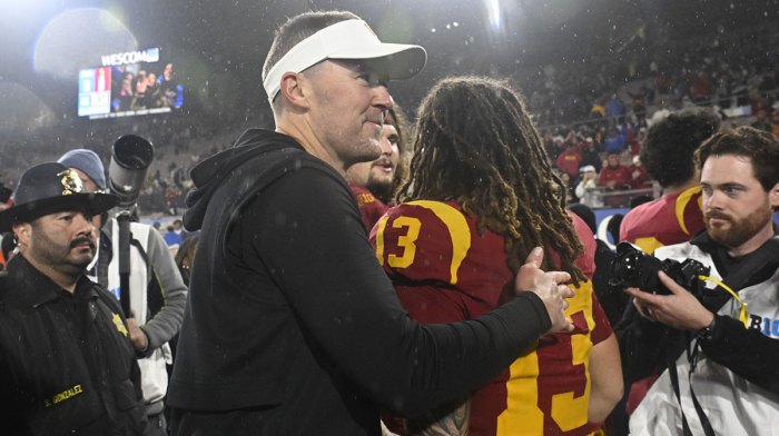 USC football head coach Lincoln Riley smiles after Trojans defeat the UCLA Bruins at Rose Bowl.