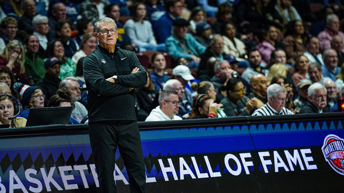 UConn women's basketball head coach Geno Auriemma watches from the sideline as they take on the Iowa State Cyclones.