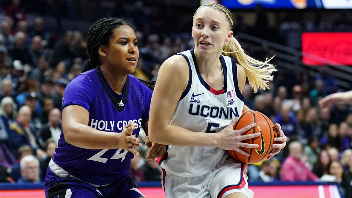 UConn Huskies guard Paige Bueckers (5) drives the ball against Holy Cross Crusaders guard Simone Foreman (24) in the second half.