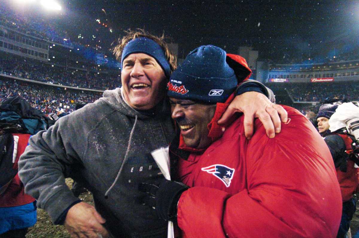 Patriots head coach Bill Belichick celebrates with then-defensive coordinator Romeo Crennel after New England defeated the Indianapolis Colts to advance to the AFC Championship game.
