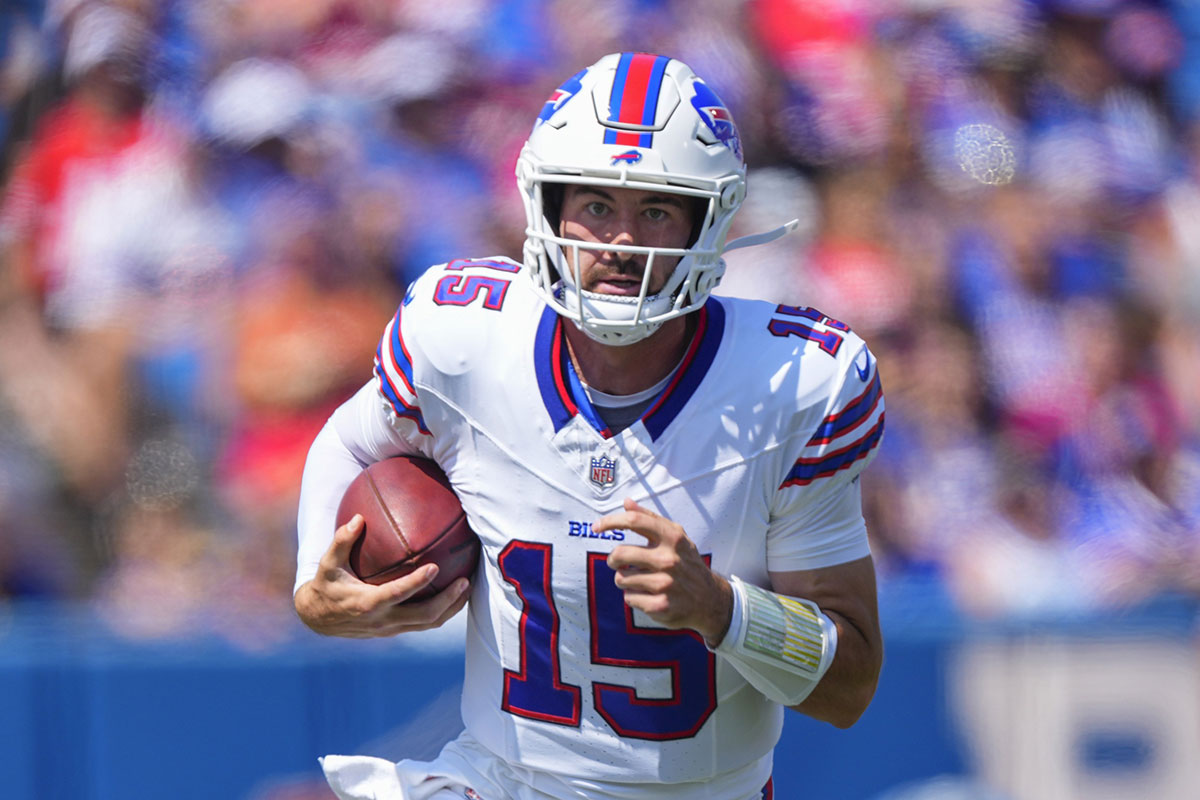 Buffalo Bills quarterback Ben DiNucci (15) runs with the ball against the Carolina Panthers during the first half at Highmark Stadium.