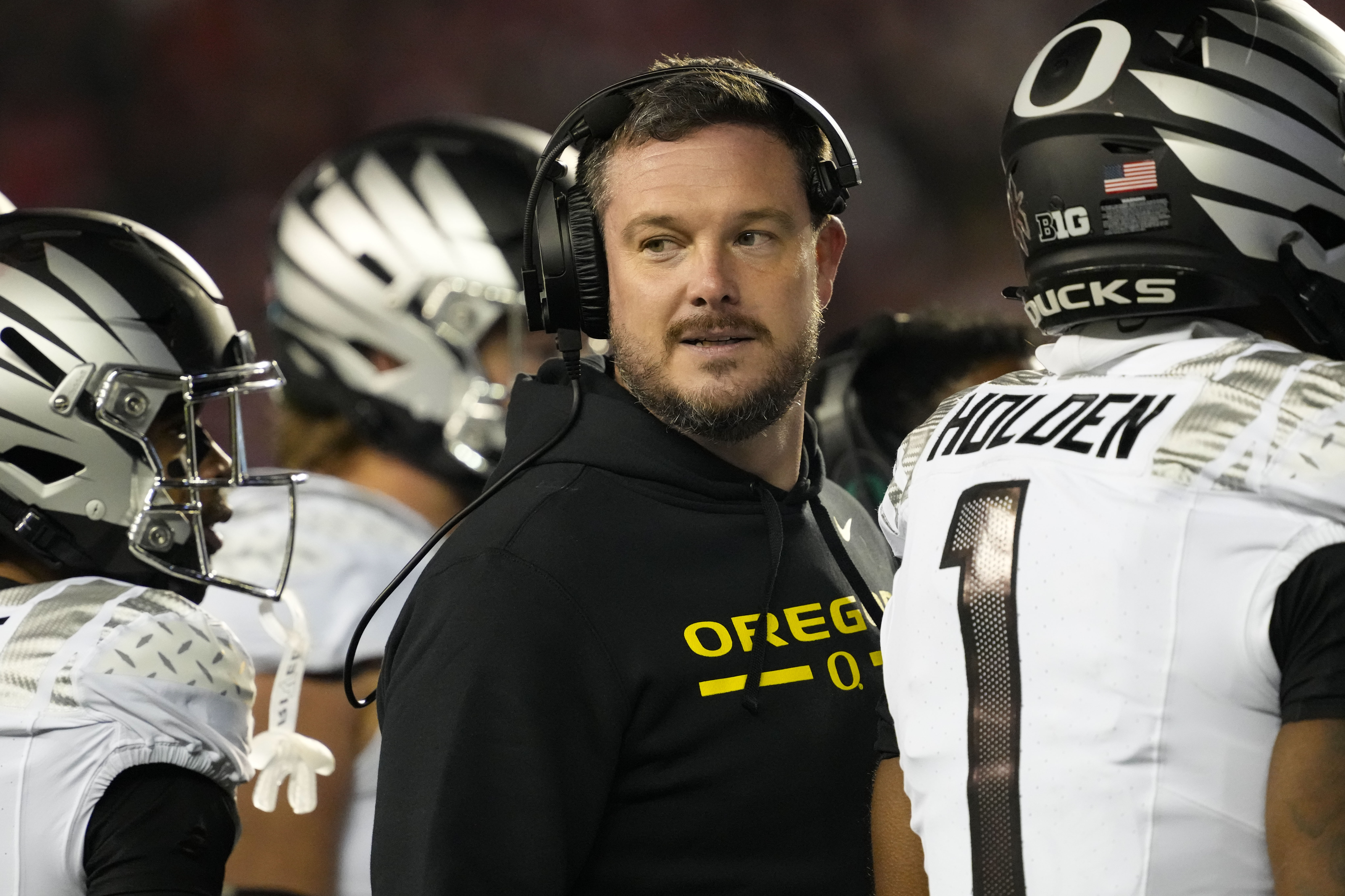 Oregon Ducks head coach Dan Lanning looks on during the third quarter against the Wisconsin Badgers at Camp Randall Stadium.