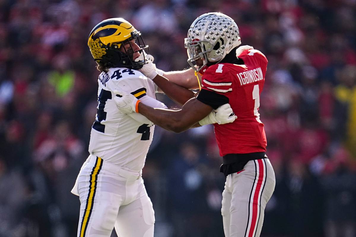 Ohio State Buckeyes cornerback Davison Igbinosun (1) locks up with Michigan Wolverines tight end Max Bredeson (44) during the NCAA football game at Ohio Stadium
