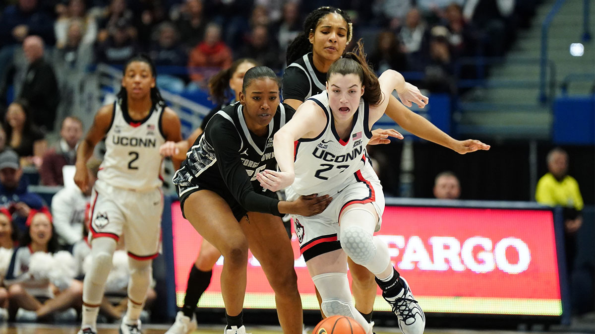 UConn Huskies guard Morgan Cheli (23) steals the ball from Georgetown Hoyas forward Kaliyah Myricks (25) in the first half.