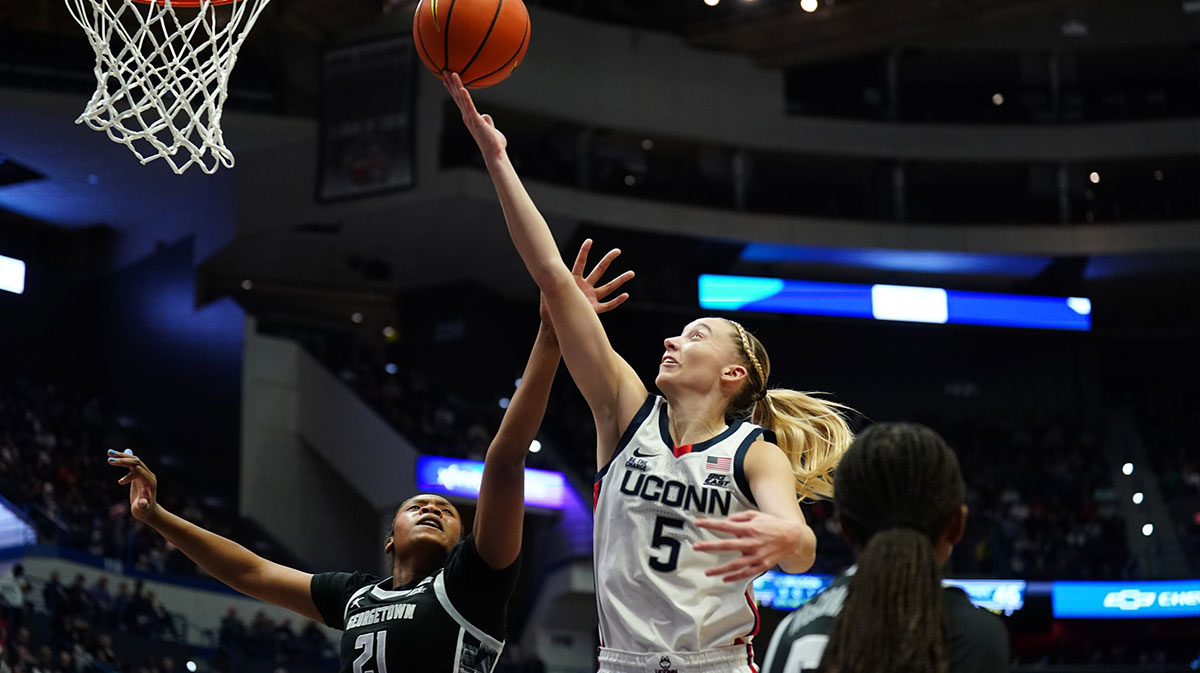 UConn Huskies guard Paige Bueckers (5) makes the basket against Georgetown Hoyas center Ariel Jenkins (21) in the second half,